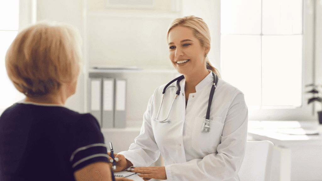 Patient consulting with a smiling doctor in a clinic