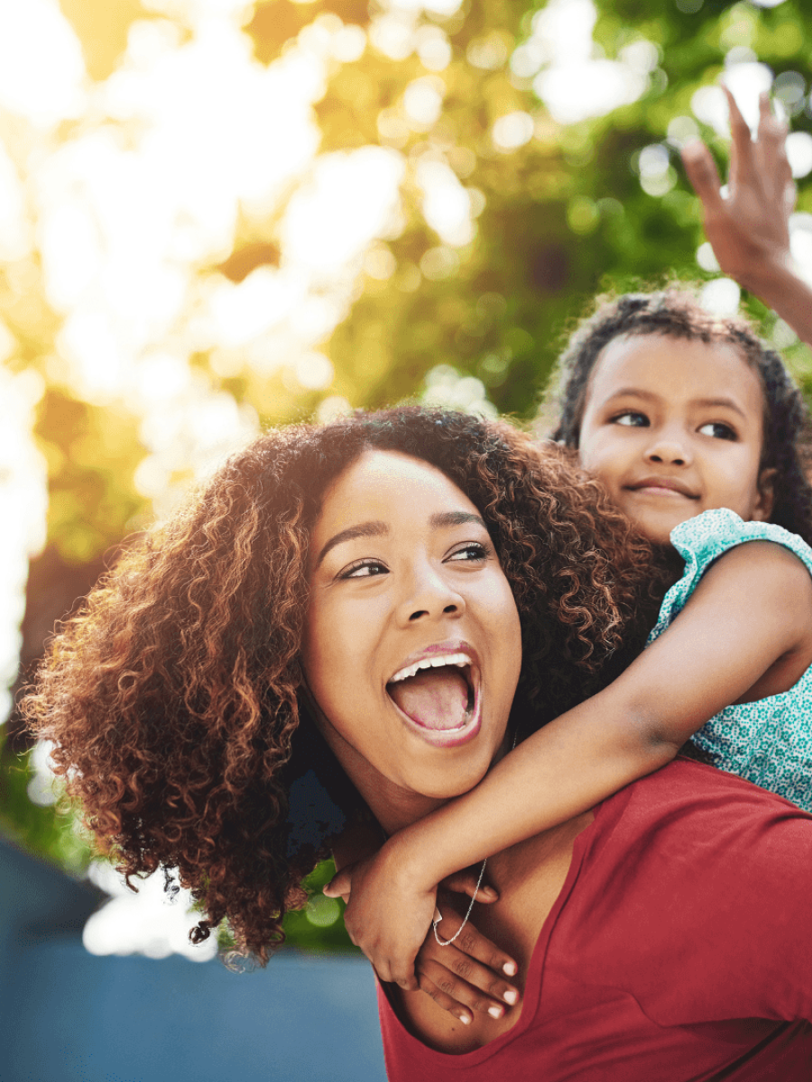 Happy family enjoying outdoors - Family medical coverage